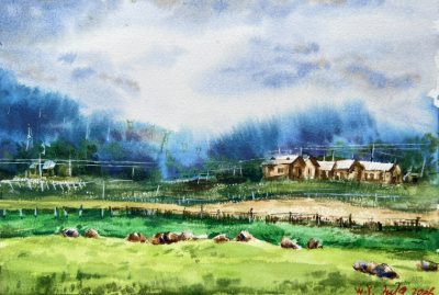 A watercolour of a farm village under a heavy blue storm sky, cattle grazing across a bright green field.